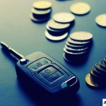 Car keys and coins lying on the table