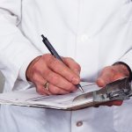 In the photo - a doctor signing a certificate for a driver deprived of his license